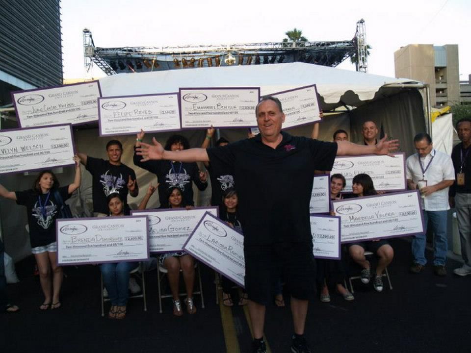 Basketball icon Ray Arvizu stands with students awarded scholarships through the Cinco de Mayo Phoenix Festival