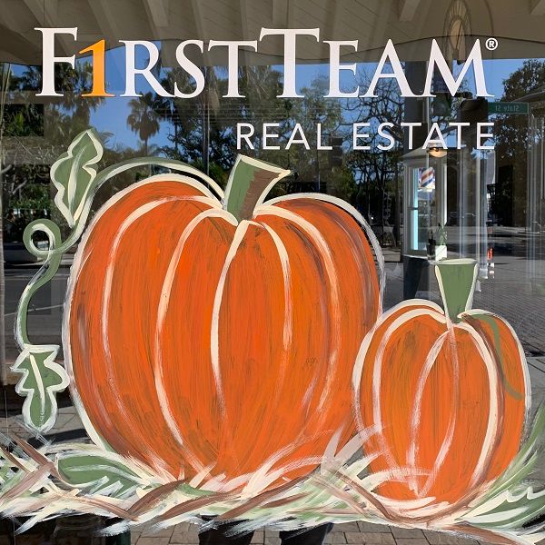 First Team Real Estate Adds A Festive Fall Flair To Village Business Windows