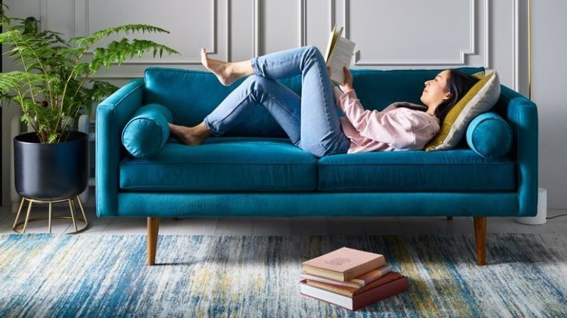 Woman on blue sofa
