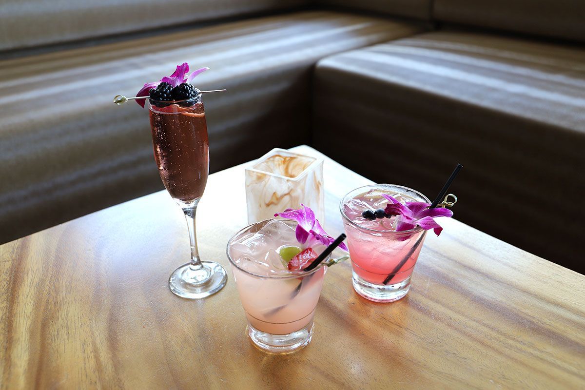 Three cocktails with orchids