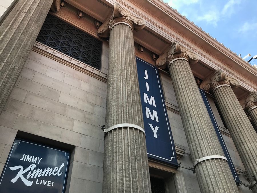 A close-up of the colonnade in May 2022. Banners promote ABC’s late-night talk show, Jimmy Kimmel Live!, which has been produced from a studio inside the building since 2003.