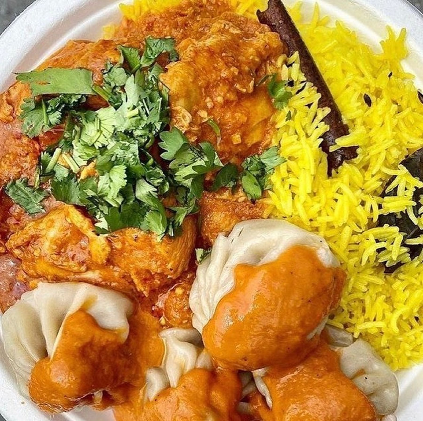 savory food options from Binis kitchen including rice, momos, and curry