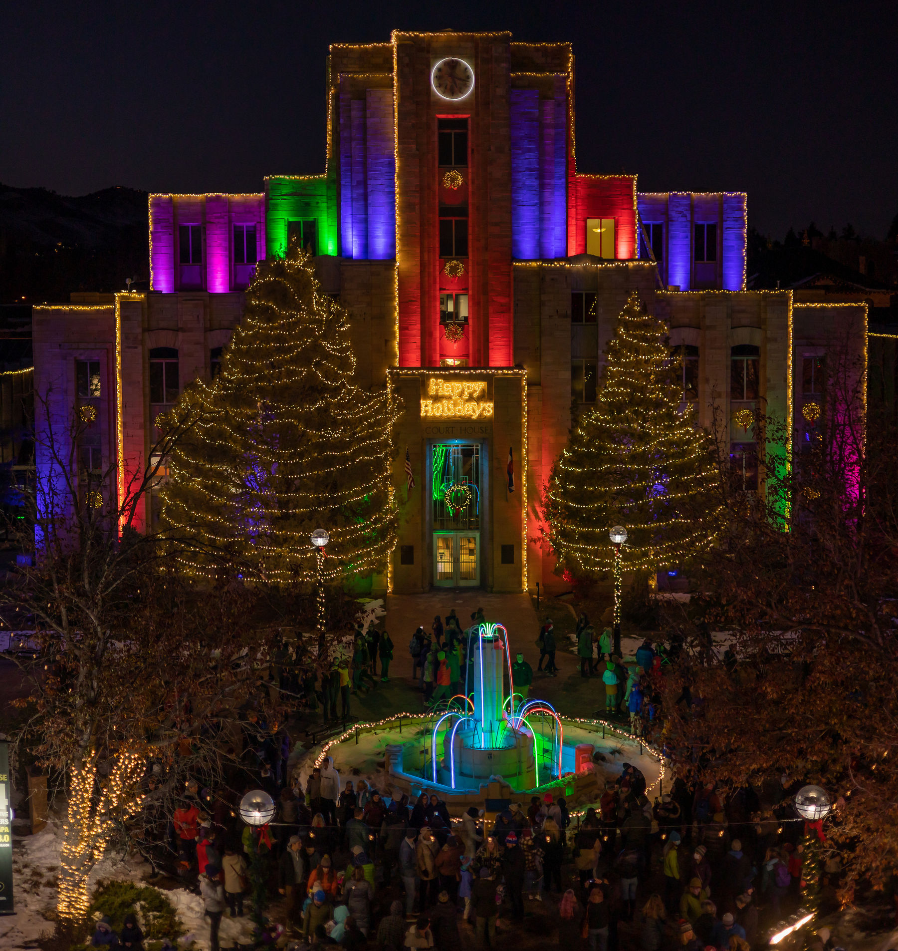 A aerial view of the Pearl Street Mall and Boulder County Courthouse with holiday lights