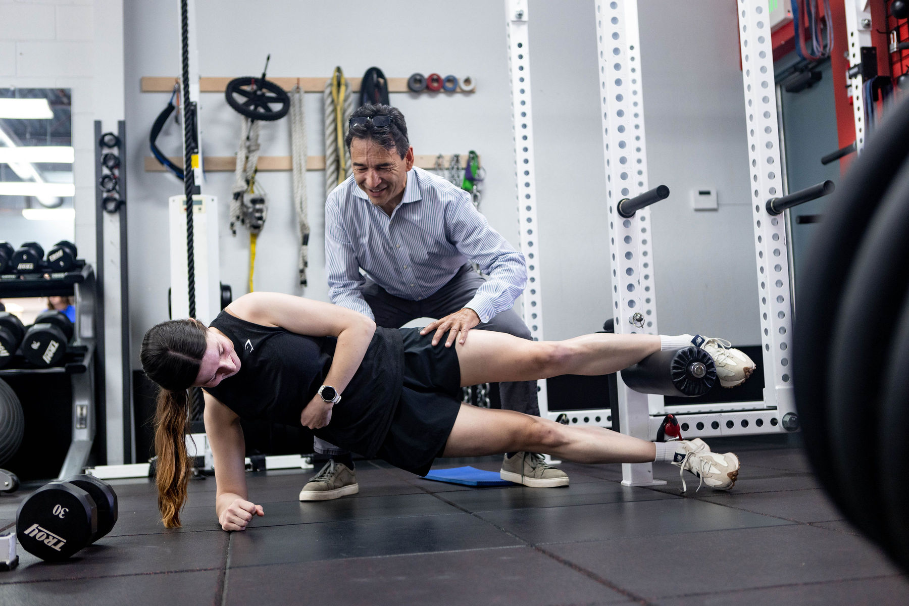 physical therapist and client working on strengthening legs