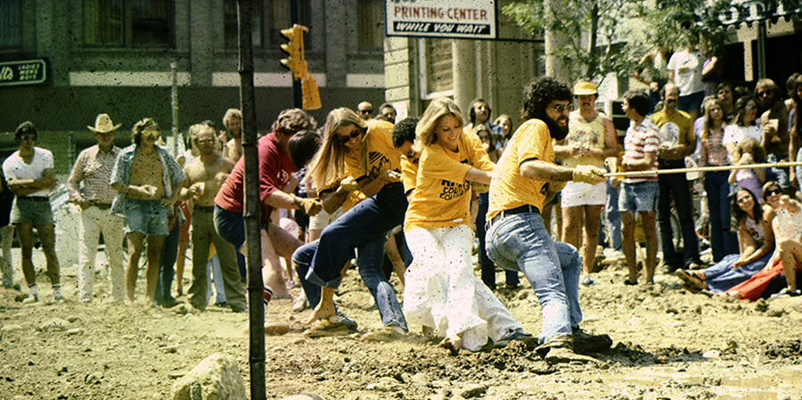 young people playing tug-of-war on the pearl street mall before it was paved