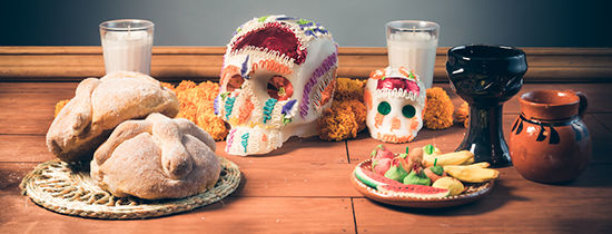 Sugar skulls, bread of the dead, and other food set out for day of the dead