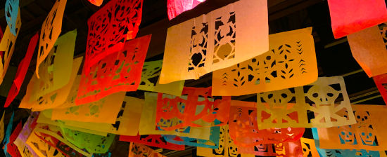 papel picado hanging at  day of the dead celebration