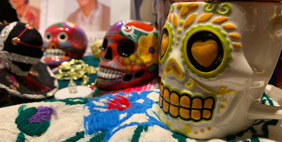 three skulls on a day of the dead altar