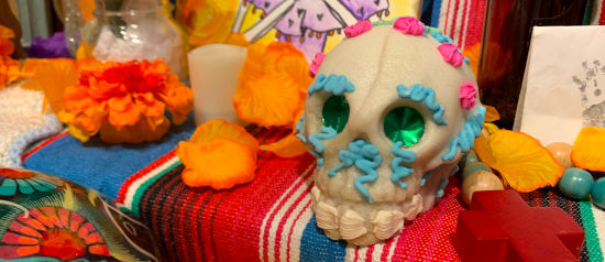 a sugar skull on a day of the dead altar