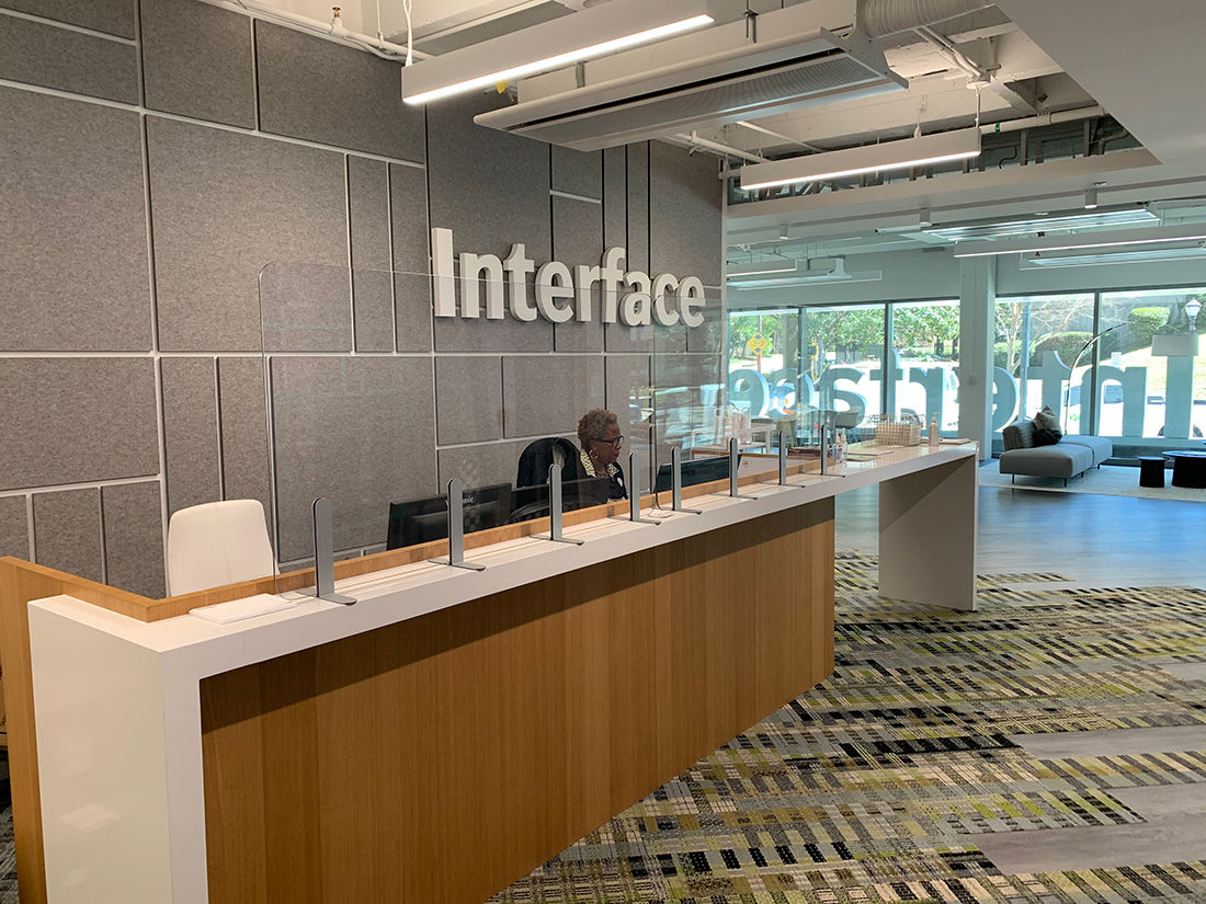 Interface's Base Camp has a new clear partition in the reception area for the protection of guests and employees. 