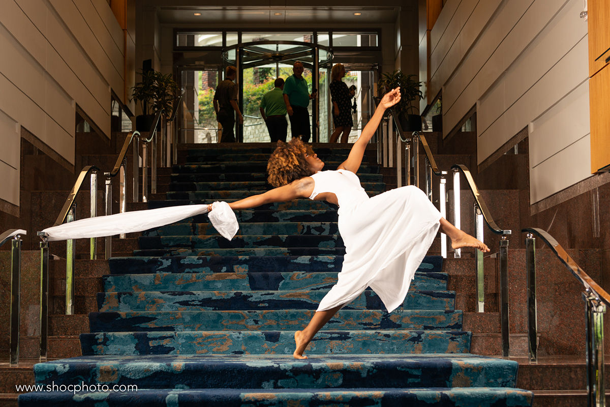 Two dancers on the staircase at Promenade.