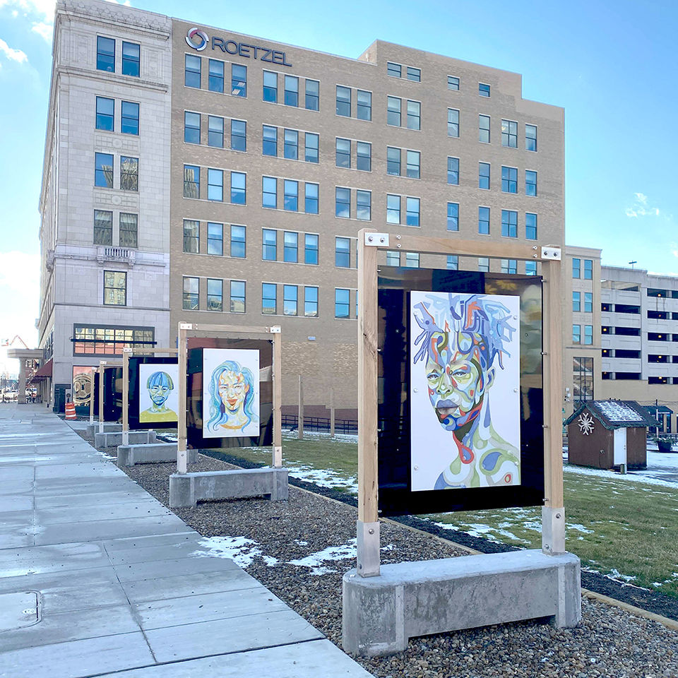Photograph of We Are installed in the outdoor art gallery at Lock 3