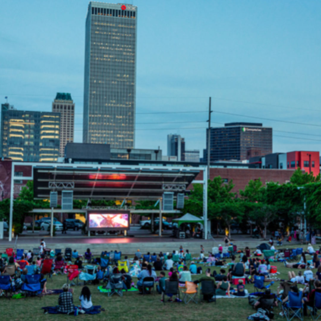 People watch a movie on Guthrie Green Lawn