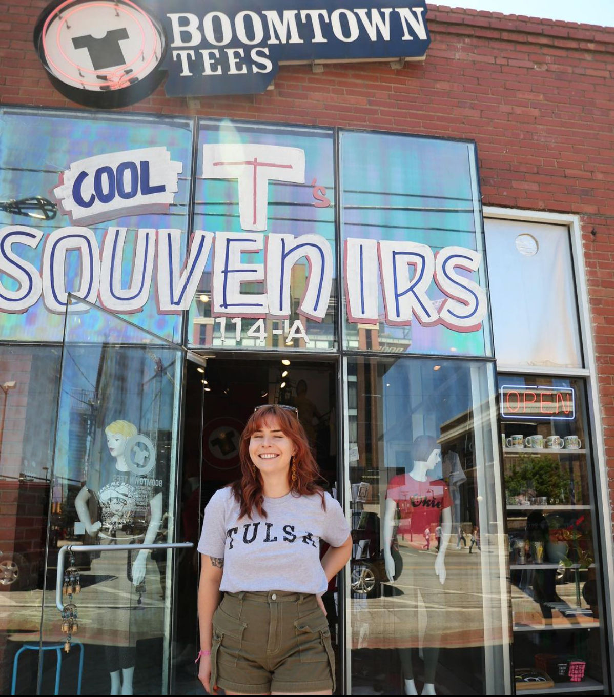 Image of Boomtown Tees storefront and owner Michelle Cozzaglio